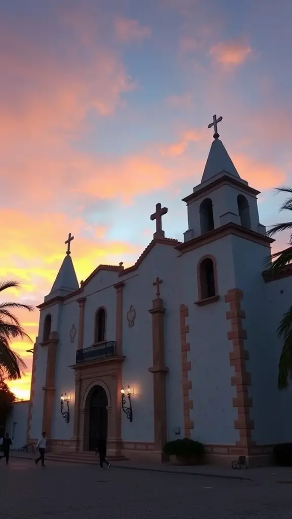 Mission San Xavier del Bac at sunset with colorful sky and palm trees