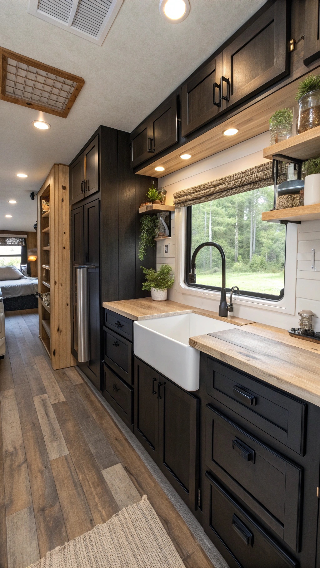 RV interior with black shaker cabinets and farmhouse sink