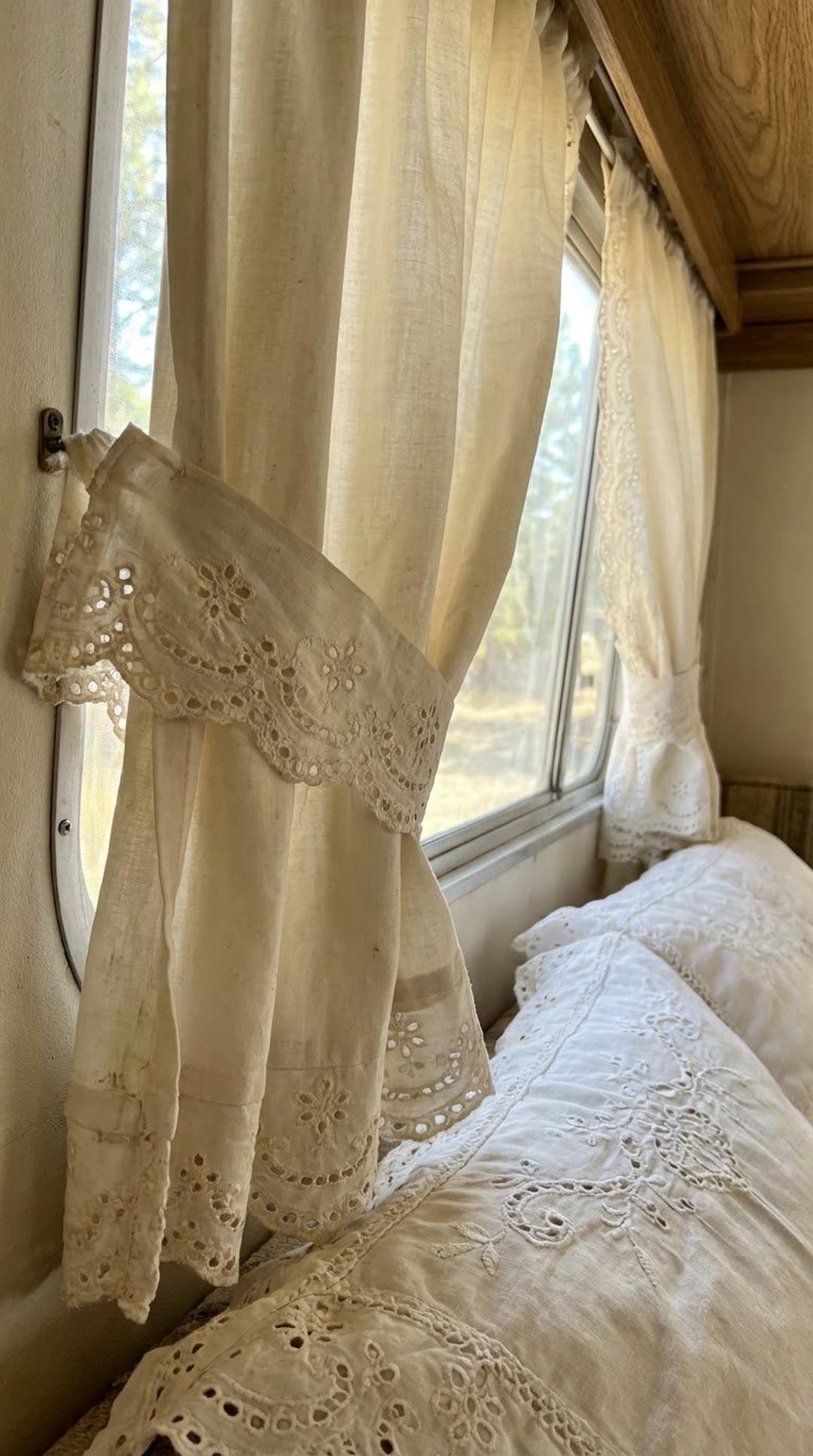 Eyelet lace trim on white cotton fabric in vintage style